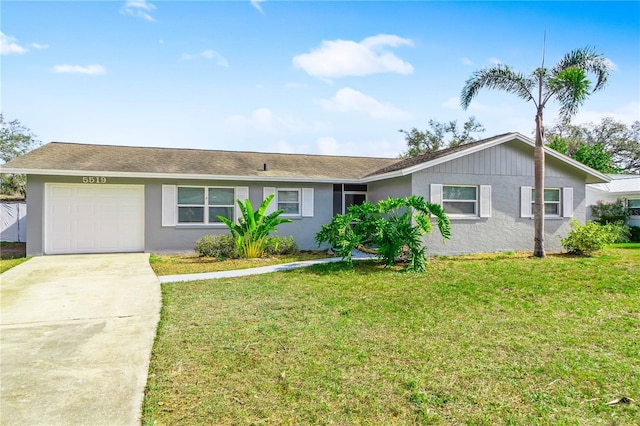 5519 Homewood Dr, Sarasota, FL 34232 - single story home featuring a garage, a front yard, stucco siding, and concrete driveway