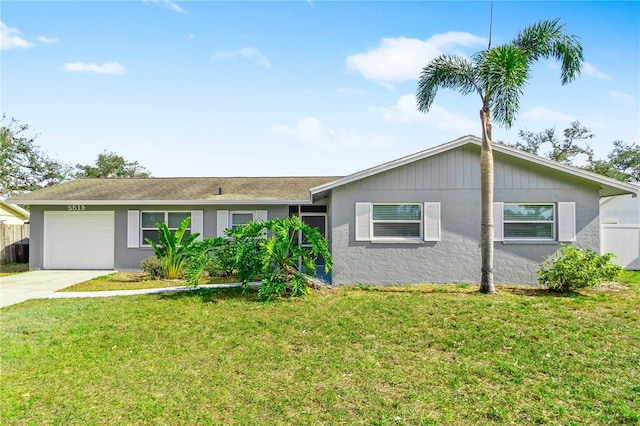 5519 Homewood Dr, Sarasota, FL 34232 - single story home featuring stucco siding, fence, a front lawn, a garage, and driveway