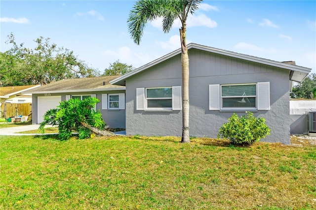 5519 Homewood Dr, Sarasota, FL 34232 - view of front facade with a front lawn, stucco siding, fence, and an attached garage