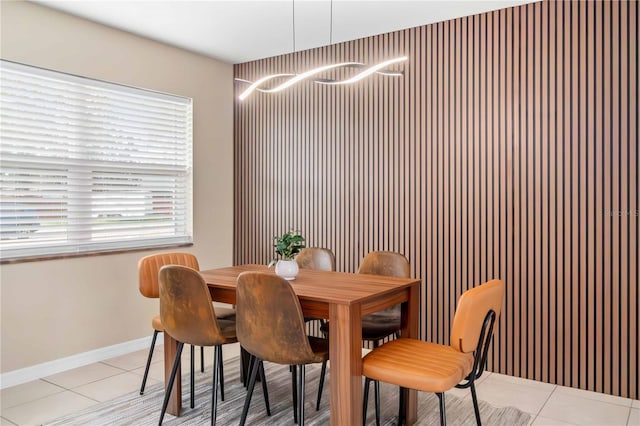 5519 Homewood Dr, Sarasota, FL 34232 - dining room featuring a chandelier, light tile patterned flooring, and baseboards