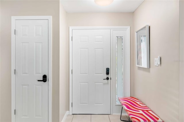 5519 Homewood Dr, Sarasota, FL 34232 - doorway to outside featuring baseboards and light tile patterned flooring