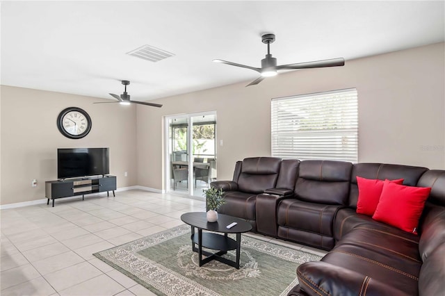 5519 Homewood Dr, Sarasota, FL 34232 - living room with light tile patterned floors, visible vents, baseboards, and ceiling fan