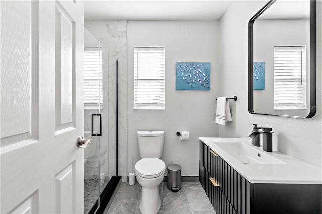 5519 Homewood Dr, Sarasota, FL 34232 - bathroom with tile patterned flooring, vanity, a marble finish shower, and toilet