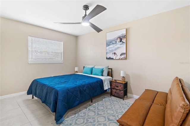 5519 Homewood Dr, Sarasota, FL 34232 - bedroom with tile patterned flooring, baseboards, and ceiling fan