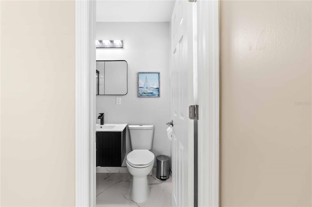 5519 Homewood Dr, Sarasota, FL 34232 - bathroom with toilet, marble finish floor, and vanity