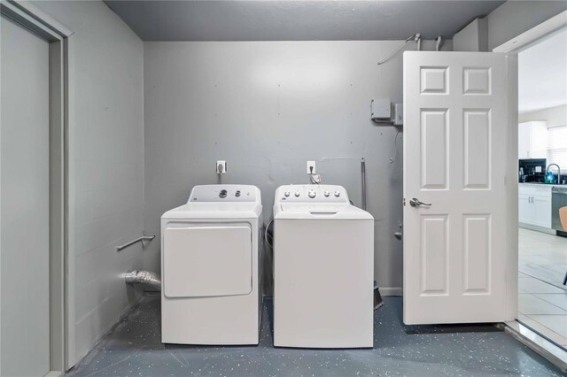 5519 Homewood Dr, Sarasota, FL 34232 - washroom with a sink, separate washer and dryer, and laundry area