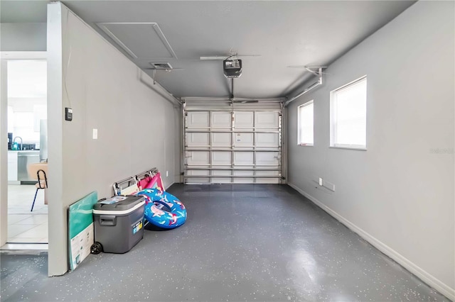 5519 Homewood Dr, Sarasota, FL 34232 - garage featuring a garage door opener, baseboards, and visible vents