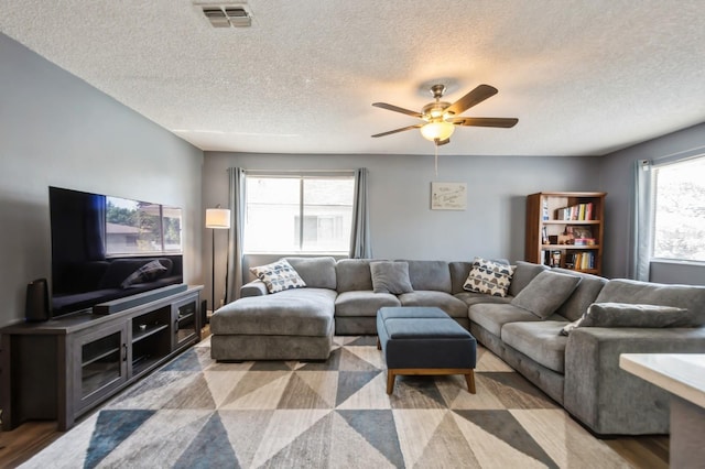 1821 Bough Ave Unit 4, Clearwater, FL 33760 - living area with a ceiling fan and a textured ceiling