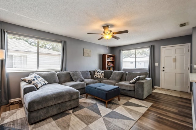 1821 Bough Ave Unit 4, Clearwater, FL 33760 - living room featuring a textured ceiling, wood finished floors, and a ceiling fan