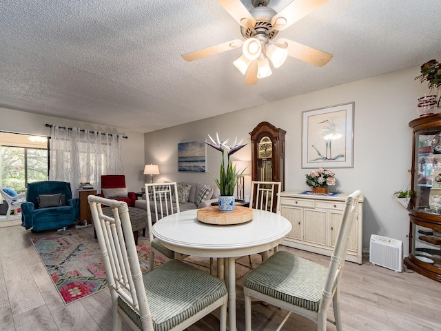 2555 Royal Pines Cir Unit A, Clearwater, FL 33763 - dining area with light wood-type flooring, a textured ceiling, and a ceiling fan