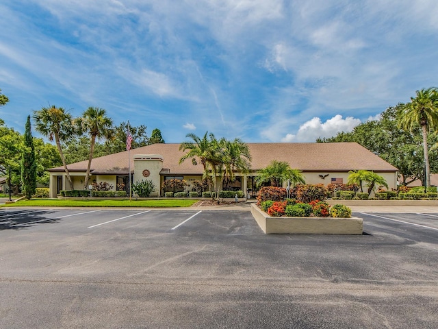 2555 Royal Pines Cir Unit A, Clearwater, FL 33763 - view of building exterior with uncovered parking