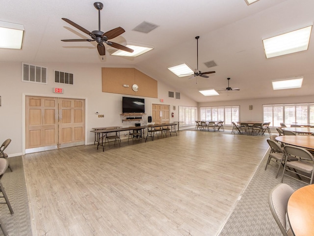 2555 Royal Pines Cir Unit A, Clearwater, FL 33763 - miscellaneous room featuring a ceiling fan, high vaulted ceiling, wood finished floors, and a skylight