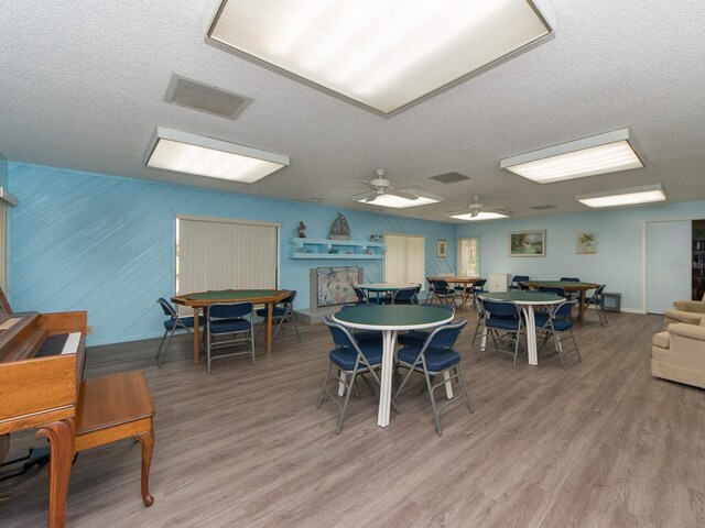 2555 Royal Pines Cir Unit A, Clearwater, FL 33763 - dining room with a textured ceiling, wood finished floors, and a ceiling fan