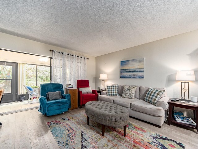2555 Royal Pines Cir Unit A, Clearwater, FL 33763 - living area with wood finished floors and a textured ceiling
