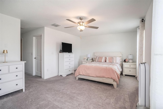bedroom with light colored carpet, baseboards, a ceiling fan, and visible vents