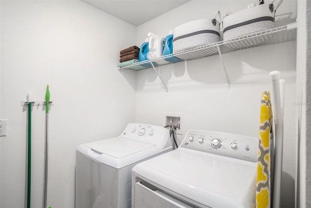 laundry area featuring washer and clothes dryer and laundry area