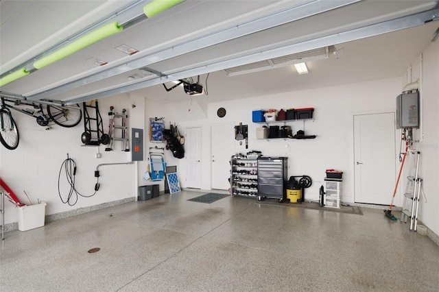 946 Highland Ave Unit 47, Dunedin, FL 34698 - garage with a garage door opener, tankless water heater, and electric panel