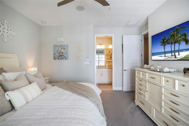 946 Highland Ave Unit 47, Dunedin, FL 34698 - bedroom with ensuite bathroom, dark carpet, and ceiling fan