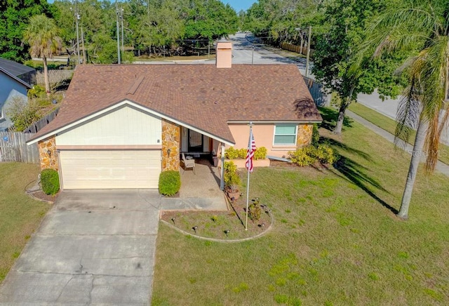10833 96th St N, Largo, FL 33773 - single story home with a chimney, fence, concrete driveway, an attached garage, and a front yard