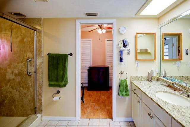 10833 96th St N, Largo, FL 33773 - bathroom featuring ceiling fan, baseboards, visible vents, and a stall shower
