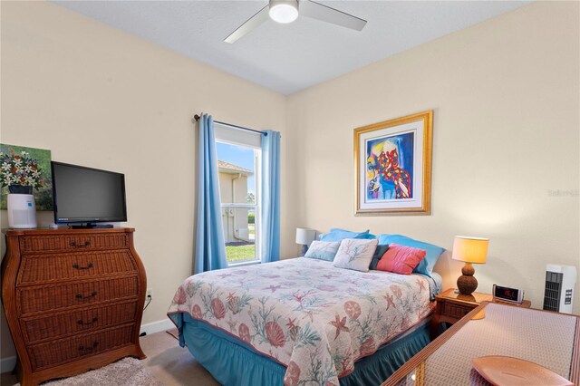 bedroom with baseboards, a ceiling fan, and carpet flooring