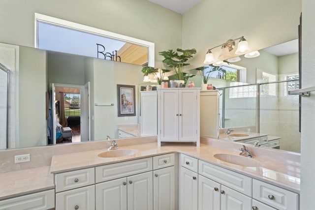 full bathroom featuring plenty of natural light, tiled shower, and a sink