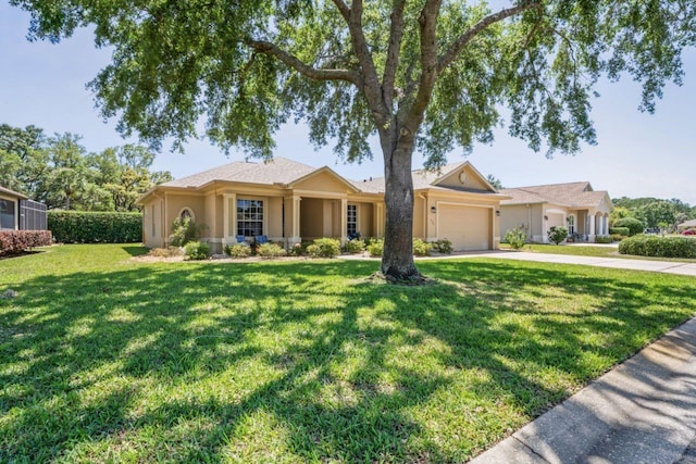 ranch-style home with stucco siding, driveway, a front yard, and a garage