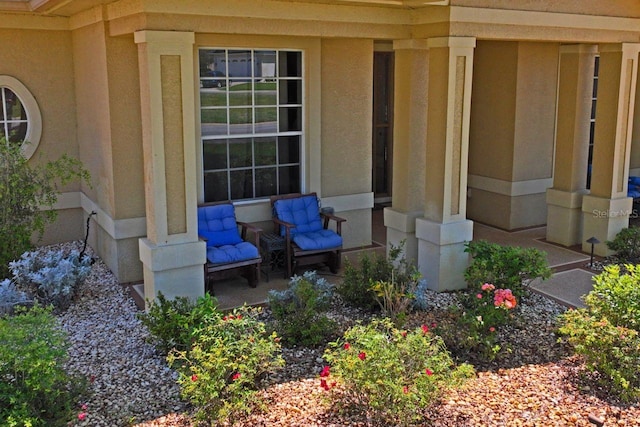 property entrance with covered porch