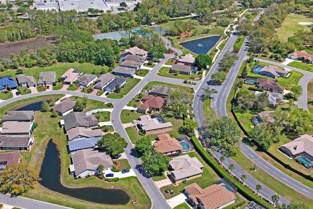 bird's eye view with a residential view and a water view