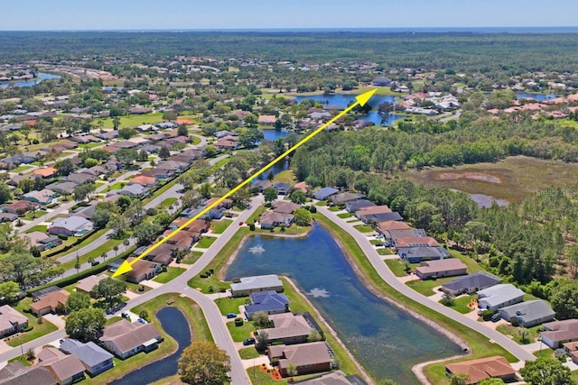 birds eye view of property with a residential view and a water view
