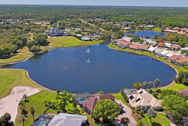 birds eye view of property with a residential view, a forest view, and a water view