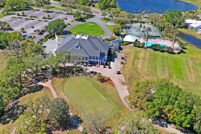 drone / aerial view featuring a water view and golf course view