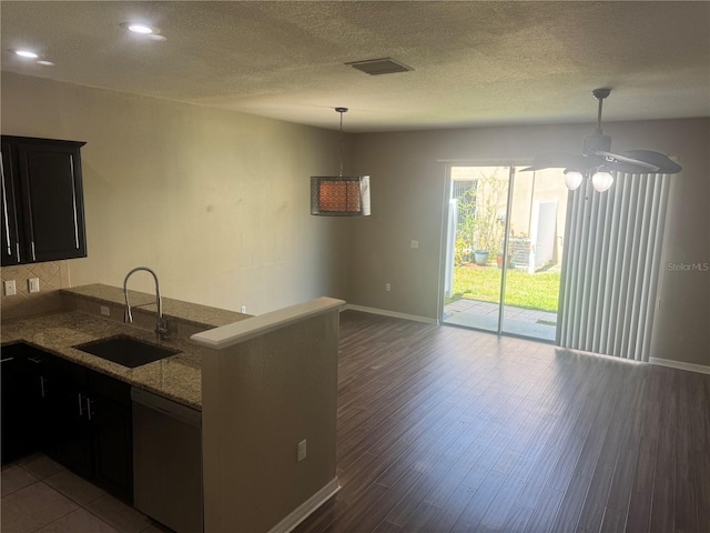 778 Spring Flowers Trl, Brandon, FL 33511 - kitchen with visible vents, dishwasher, baseboards, and a sink