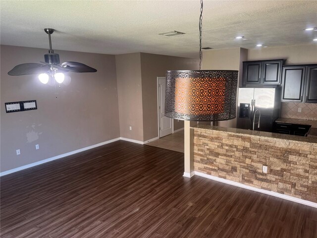778 Spring Flowers Trl, Brandon, FL 33511 - kitchen featuring dark wood-style floors, stainless steel fridge, ceiling fan, visible vents, and baseboards