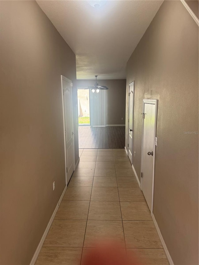778 Spring Flowers Trl, Brandon, FL 33511 - hall with baseboards and light tile patterned flooring