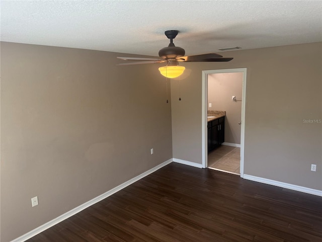 778 Spring Flowers Trl, Brandon, FL 33511 - unfurnished room with baseboards, visible vents, a ceiling fan, and dark wood-type flooring