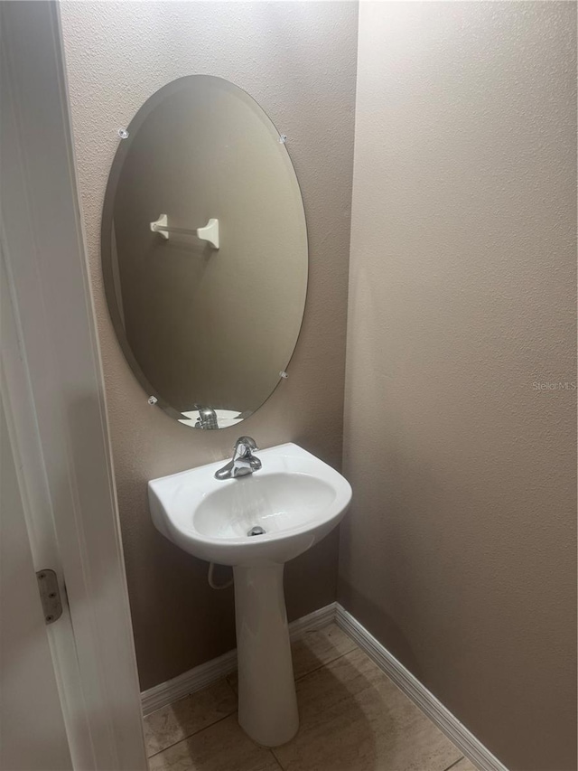 778 Spring Flowers Trl, Brandon, FL 33511 - bathroom with baseboards and tile patterned flooring