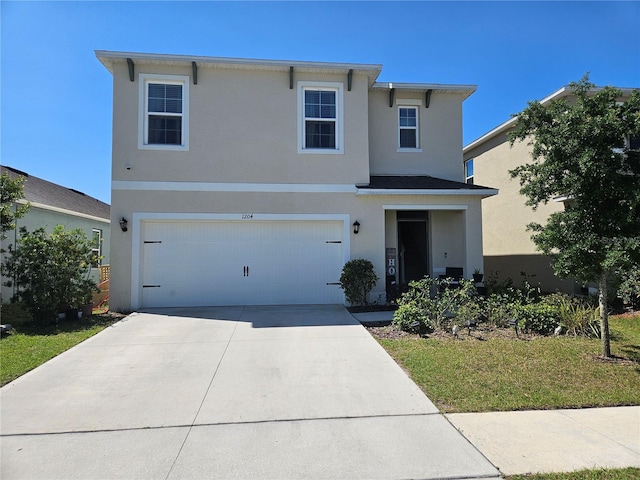traditional-style house with stucco siding, driveway, and a garage