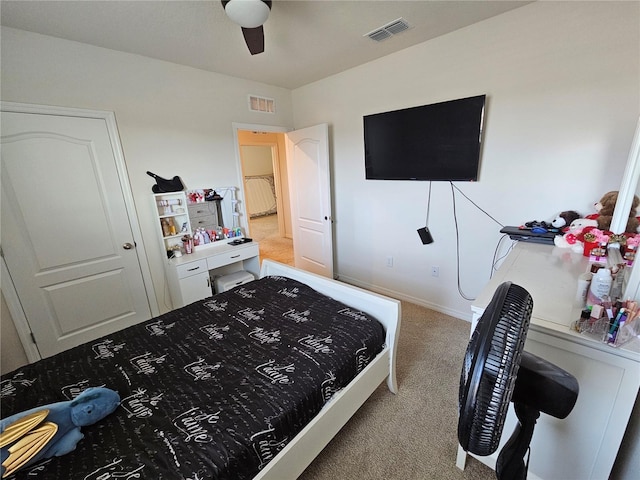 bedroom with carpet, visible vents, and ceiling fan