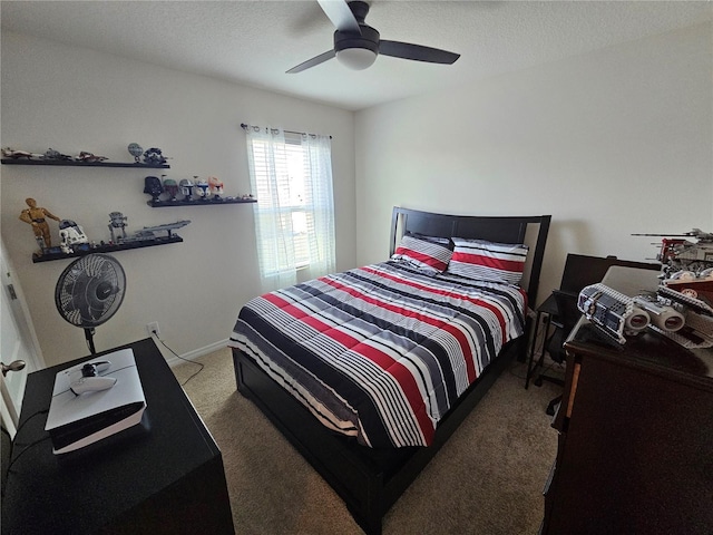 bedroom featuring a textured ceiling, carpet flooring, and ceiling fan