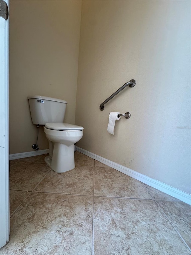 446 Noble Faire Dr, Sun City Center, FL 33573 - bathroom with toilet, tile patterned flooring, and baseboards