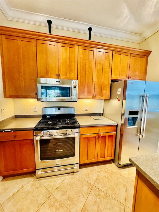 446 Noble Faire Dr, Sun City Center, FL 33573 - kitchen featuring crown molding, light tile patterned flooring, appliances with stainless steel finishes, and brown cabinetry