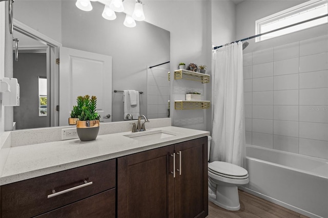 15329 Renaissance Ave, Odessa, FL 33556 - full bath with shower / tub combo with curtain, wood finished floors, vanity, and toilet
