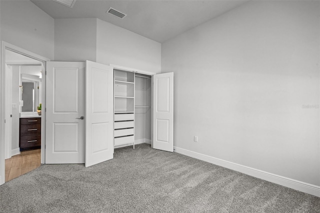 15329 Renaissance Ave, Odessa, FL 33556 - unfurnished bedroom featuring vaulted ceiling, a closet, baseboards, carpet flooring, and visible vents