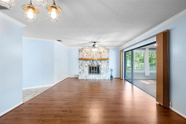 unfurnished living room with ceiling fan, wood finished floors, and ornamental molding
