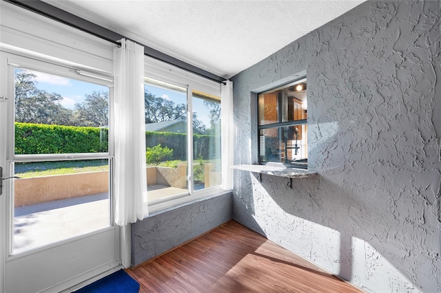 unfurnished sunroom featuring plenty of natural light