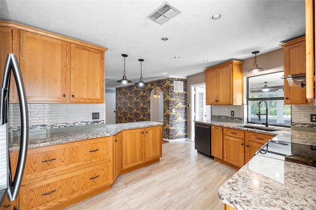 kitchen with a sink, tasteful backsplash, fridge, visible vents, and dishwasher