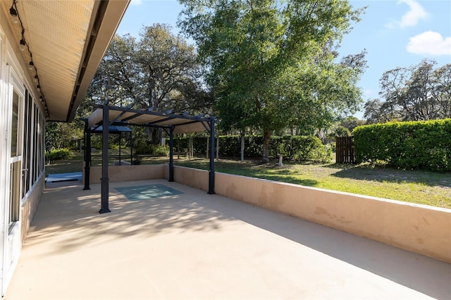 view of patio / terrace featuring a pergola and fence