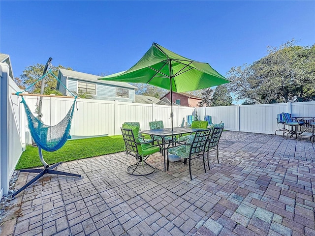 16819 Stanza Ct, Tampa, FL 33624 - view of patio with outdoor dining area and a fenced backyard