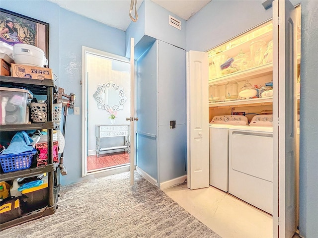 16819 Stanza Ct, Tampa, FL 33624 - laundry area with visible vents, separate washer and dryer, and laundry area